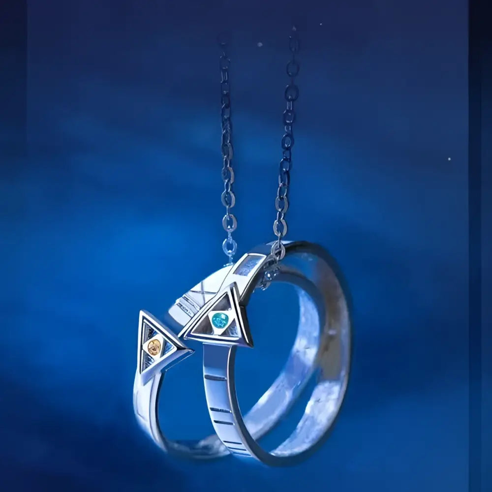 Silver necklace pendant featuring two interlocking rings with orange and green gemstones in geometric design for cosplay
