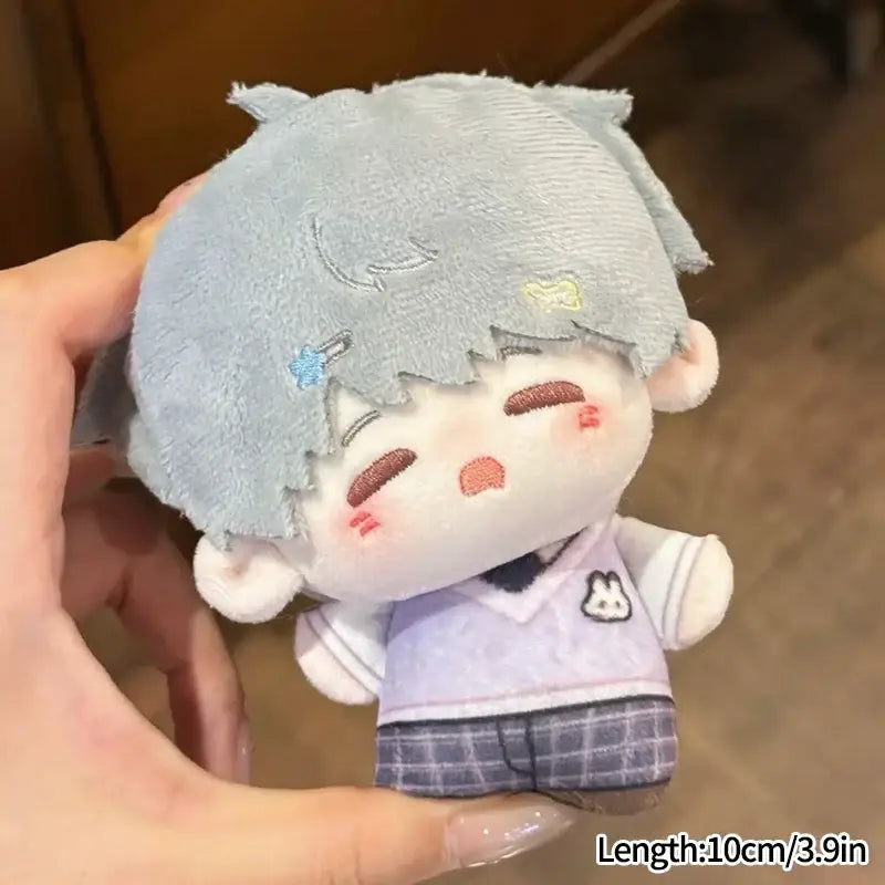 A light gray soft plush love and deepspace keychain with stitched face and star is a cute cartoon bag charm