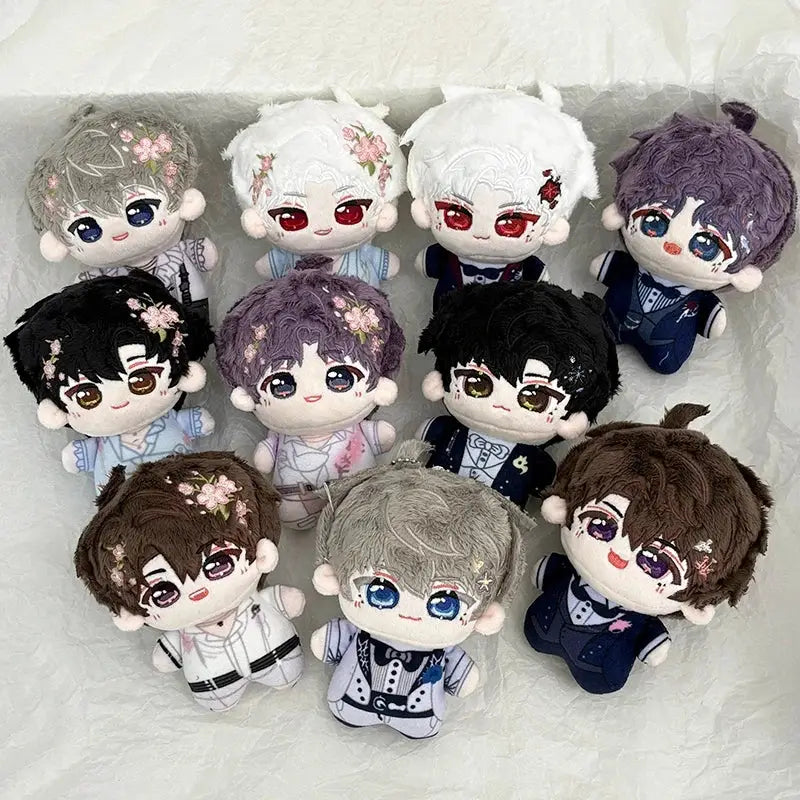 A collection of plush dolls with varied hair colors and floral embroidery as cute cartoon bag charm keychains