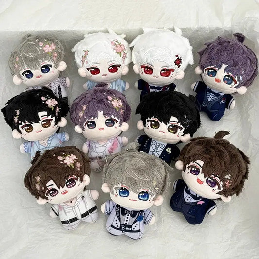 A collection of plush dolls with varied hair colors and floral embroidery as cute cartoon bag charm keychains