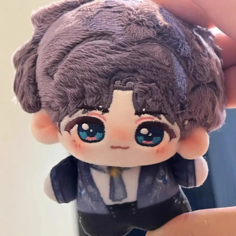 A plush love and deepspace keychain with fluffy gray hair and embroidered blue eyes cute cartoon bag charm