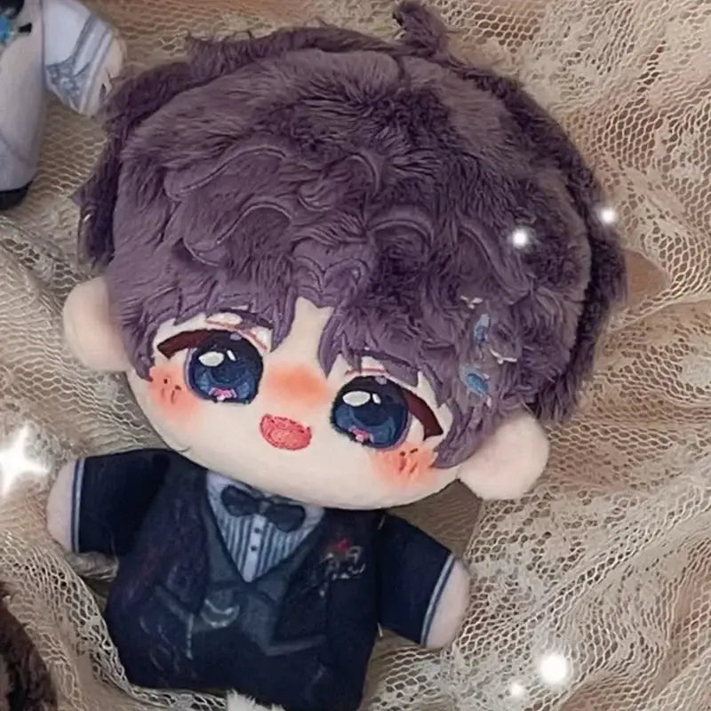 A plush doll keychain with curly purple hair dressed in a navy suit as a cute cartoon bag charm