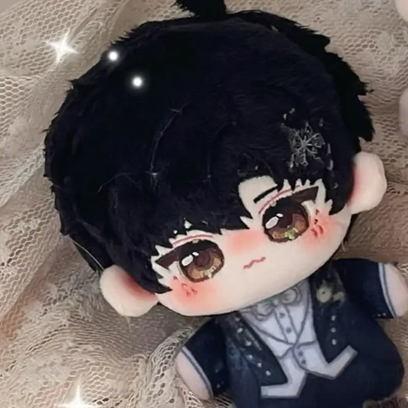 A plush love and deepspace keychain with black textured hair and brown eyes in a navy blue outfit cute cartoon bag charm