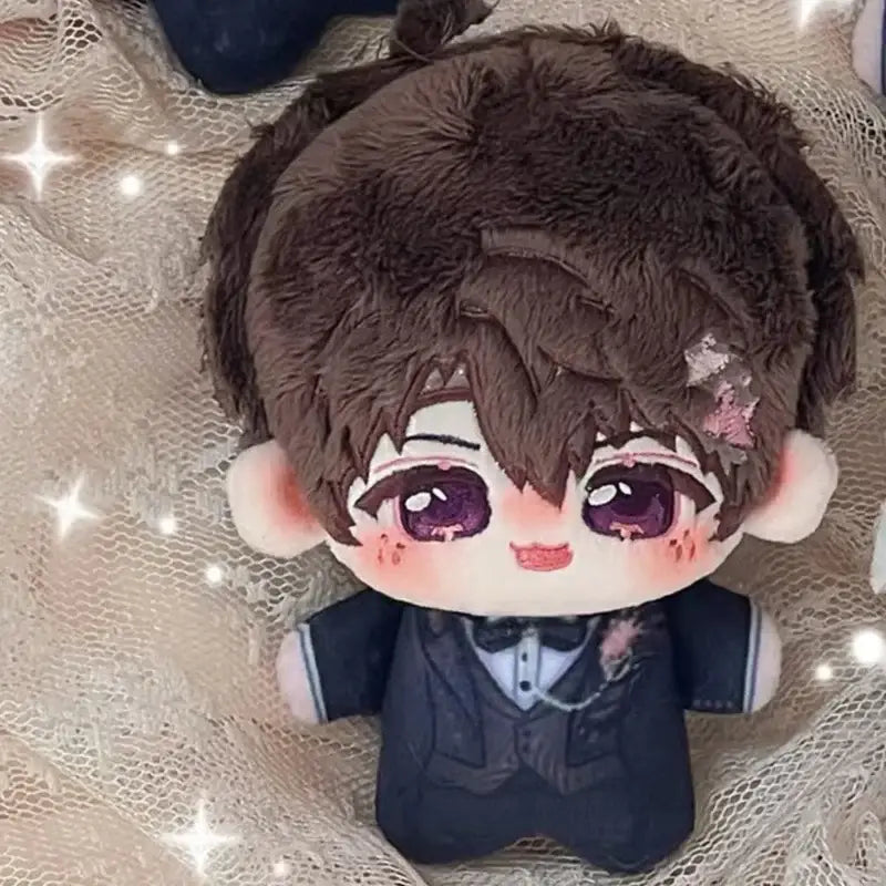 Brown plush doll with purple eyes wearing black tuxedo outfit included in love and deepspace cute cartoon bag charm