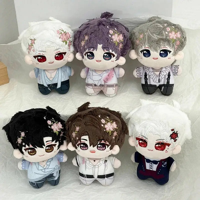 Six plush dolls with embroidered floral hair accessories and soft fabric outfits as cute cartoon bag charm keychains
