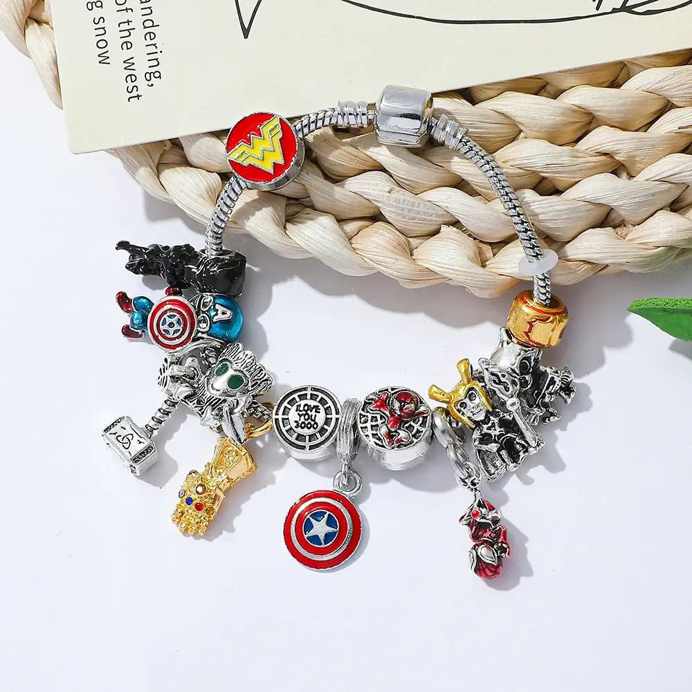 Silver and gold marvel superhero pendant bracelet featuring iconic charms like captain america shield and thor hammer
