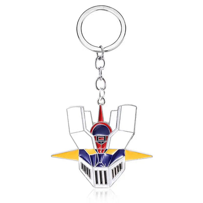 A metallic mazinger z bombardier logo keychain featuring a robot head with red blue and yellow enamel details