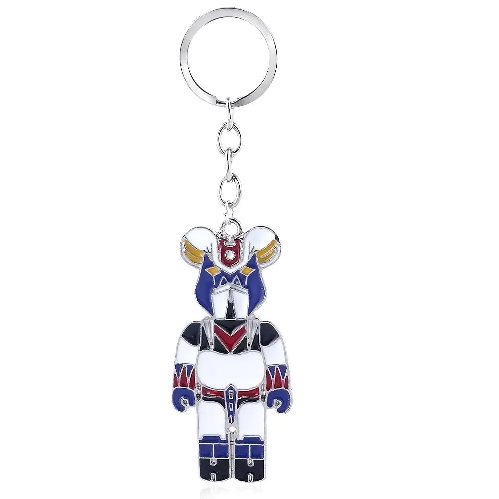 A metallic mazinger z bombardier logo keychain featuring stylized blue white armor with red and gold accents for car accessory