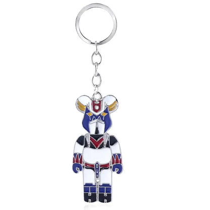 A metallic mazinger z bombardier logo keychain featuring stylized blue white armor with red and gold accents for car accessory