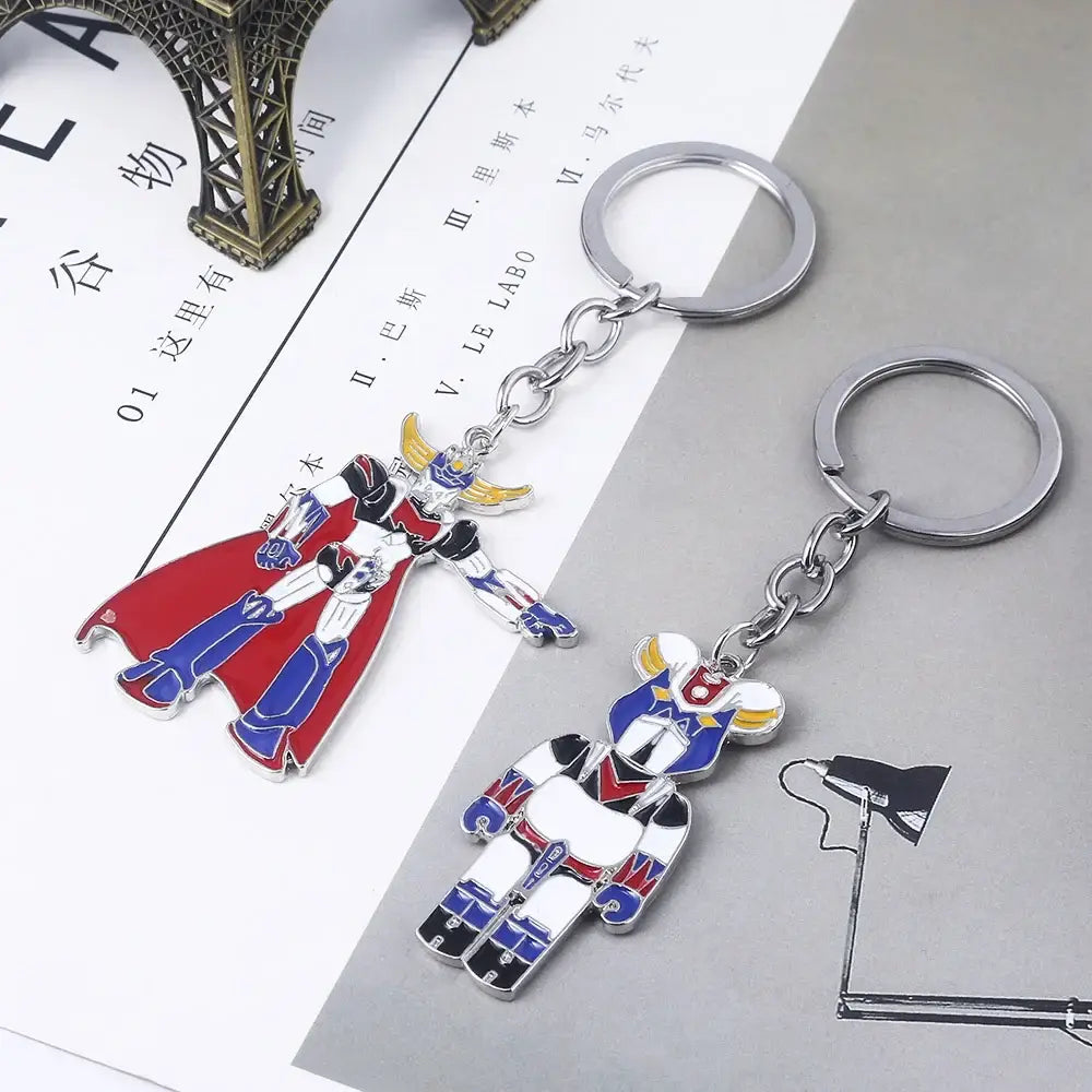 Two metallic mazinger z keychains with colorful enamel detailing featuring the bombardier logo for car accessory use