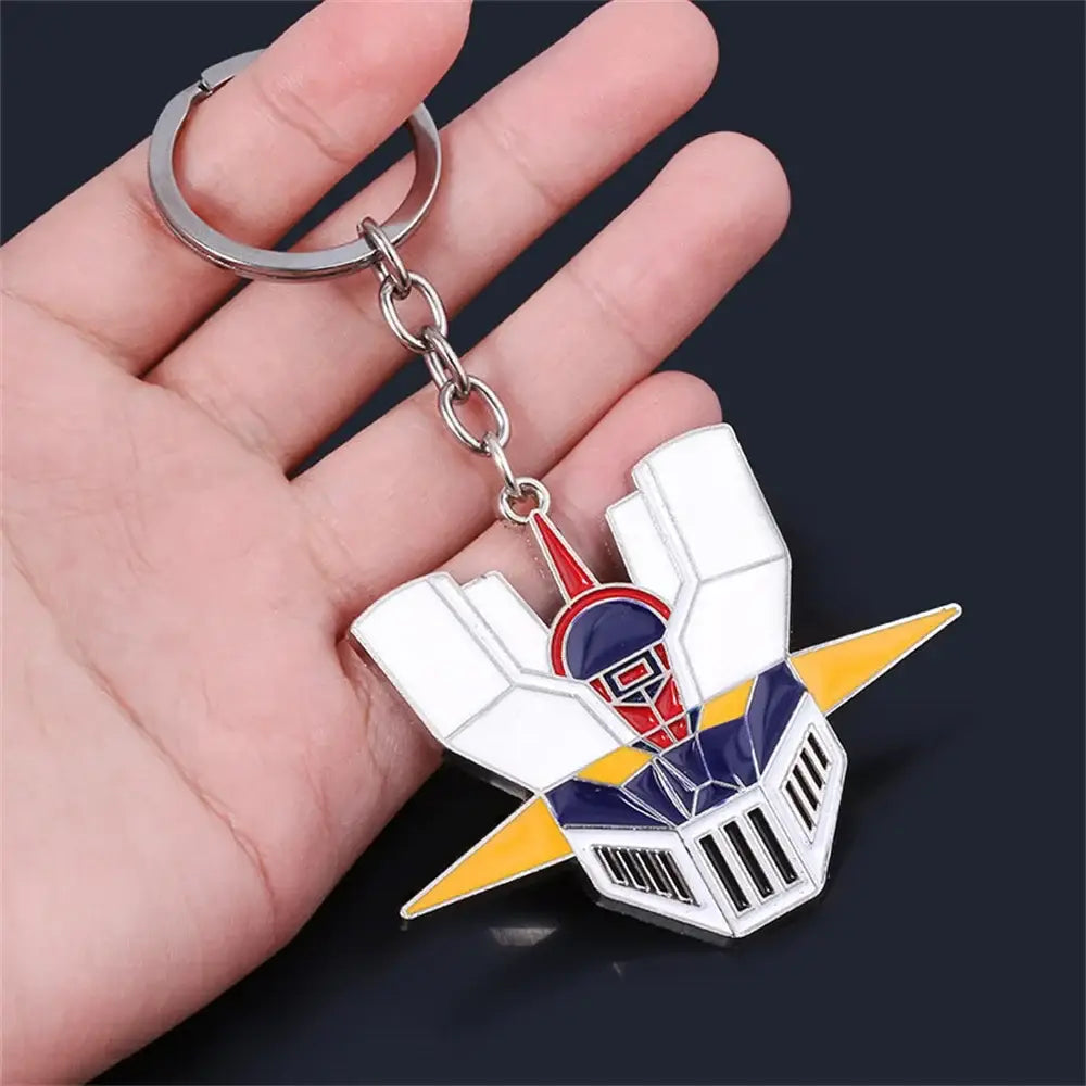 Mazinger Z bombardier logo enamel keychain in white red and blue with a robot head and yellow wing accents for car accessory