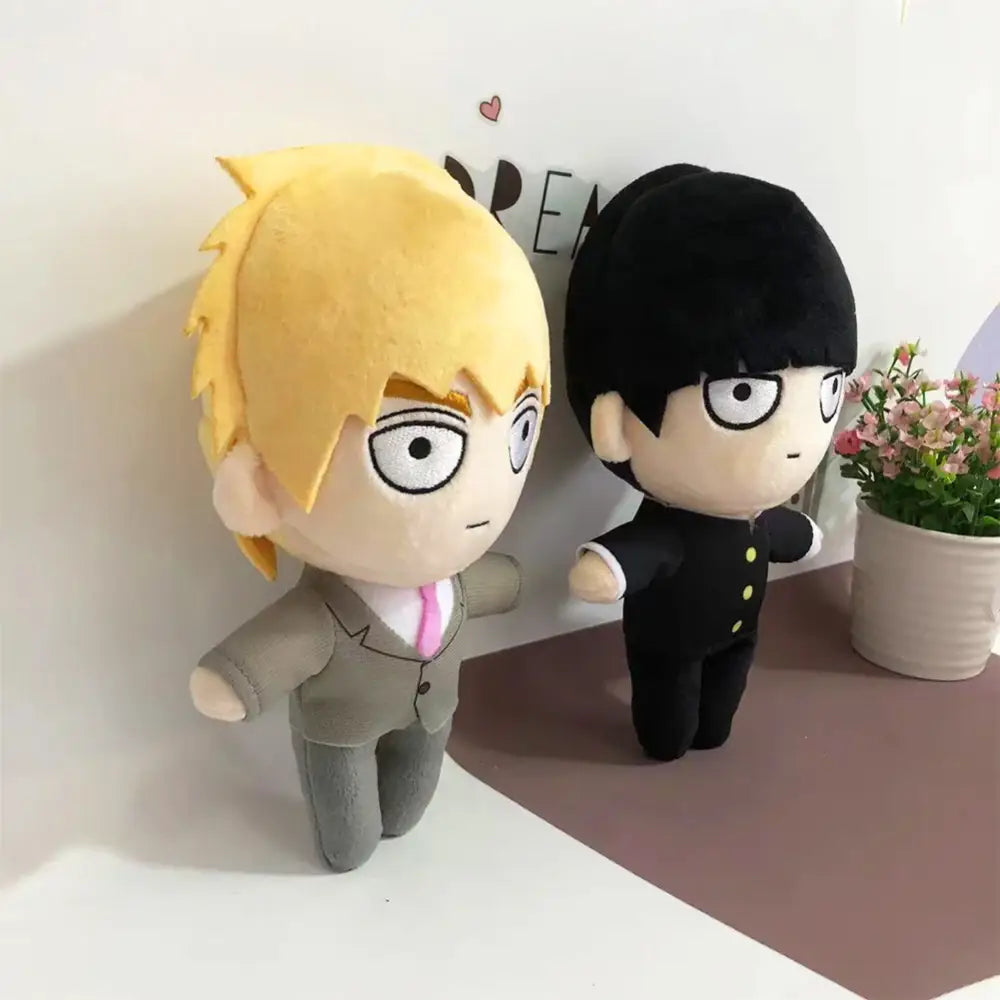 Yellow-haired mob 100 reigen arataka plush doll with spiky hair wearing gray suit and pink tie soft stuffed plush