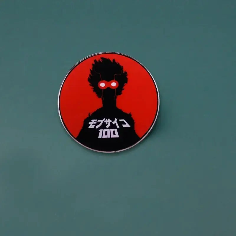 Circular metal brooch featuring kageyama shigeo enamel pin with black silhouette and red background from mob psycho 100