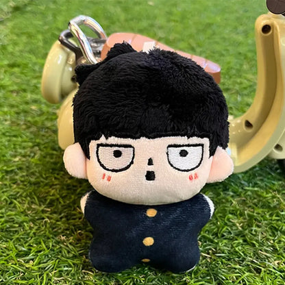 Black plush keychain of kageyama shigeo wearing a navy jacket with gold buttons in mob psycho 100 bag pendant style