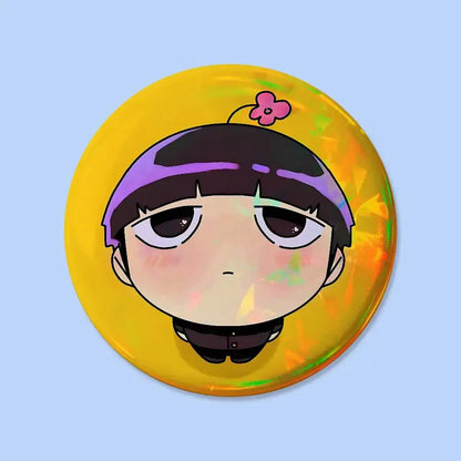 Mob psycho pin badge featuring a glossy yellow circular design with a chibi anime character and flower accessory