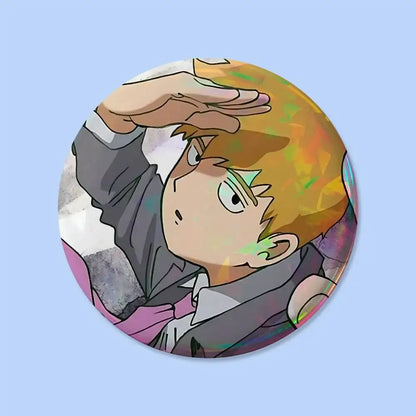 Circular mob psycho pin badge featuring orange-haired anime character in gray suit shielding his eyes in dynamic pose