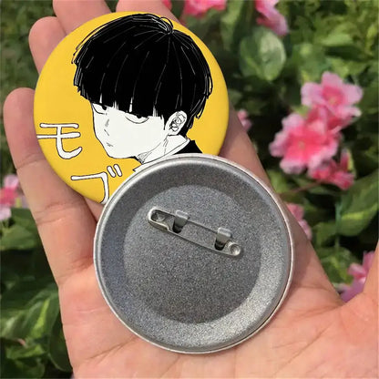Yellow circular mob psycho pin badge featuring black and white anime character illustration with japanese text