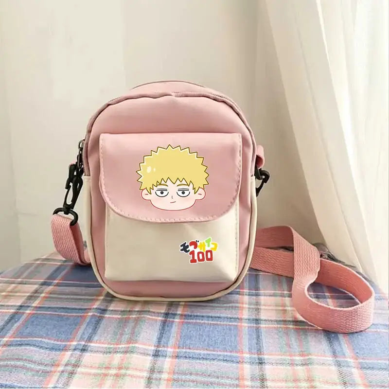 Pink and cream mob psycho 100 reigen arataka canvas crossbody bag with spiky blonde cartoon character on front flap