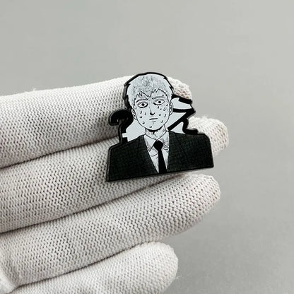 Black and silver enamel reigen arataka lapel pin featuring a stylized anime character in a suit and tie