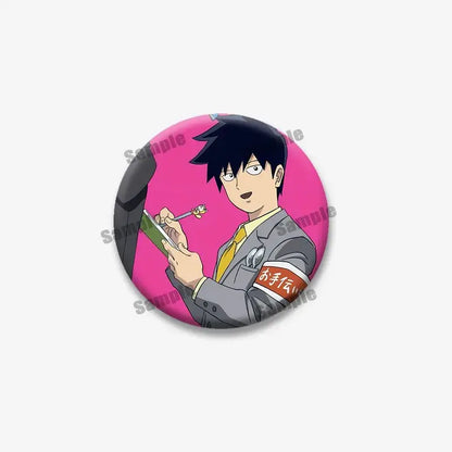 Circular mob psycho lapel pin featuring shigeo arataka with black spiky hair in gray suit and yellow tie on pink background