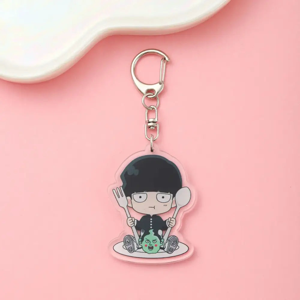 Clear acrylic shigeo kageyama acrylic keychain from mob psycho featuring cartoon character with fork and spoon on plate