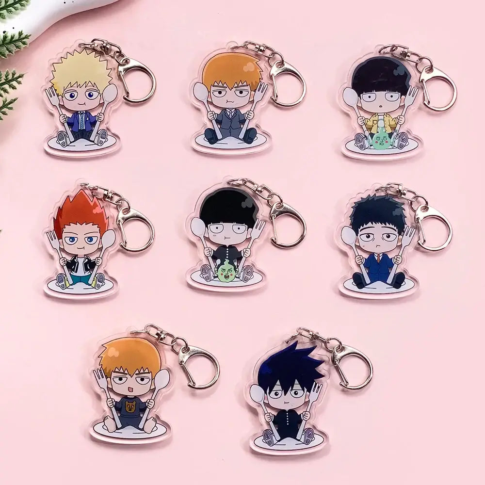 Clear acrylic shigeo kageyama acrylic keychain with chibi mob psycho character holding forks and spoons on plates