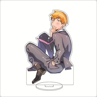Clear acrylic mob psycho ornament featuring shigeo kageyama with spiky blonde hair wearing a gray suit and black shoes