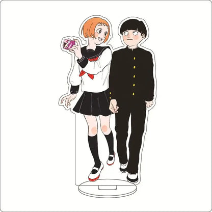 Clear acrylic ornament of mob psycho featuring shigeo kageyama and another character in school uniforms with pink camera