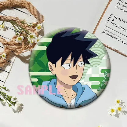 Circular mob psycho 100 shigeo kageyama button pin featuring anime character with black hair and blue jacket on green background