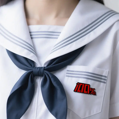 Navy blue sailor collar with gray stripes and bow tie featuring red 100 percent logo mob psycho shigeo kageyama enamel pin