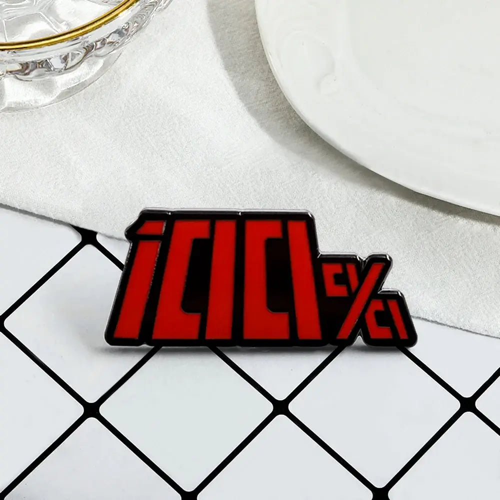 Red and black enamel pin featuring bold stylized icici lettering from mob psycho shigeo kageyama enamel brooch