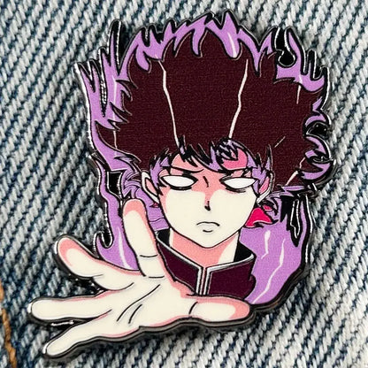 Mob psycho 100 shigeo kageyama enamel pin featuring spiky maroon and purple hair with outstretched hand badge