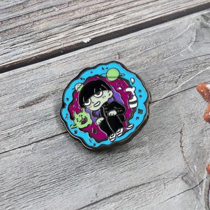 Colorful enamel floating badge featuring shigeo kageyama lapel pin sitting in cosmic scene with planets and stars