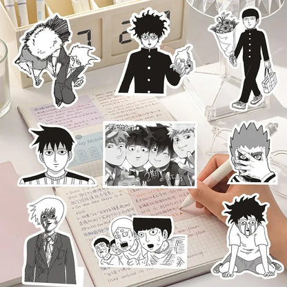Black-and-white anime shigeo kageyama sticker set with bold outlines and expressive faces on desk with notebooks