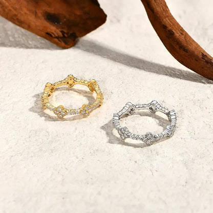 Two skeleton-themed moissanite eternity rings in gold-plated and 925 sterling silver with sparkling stones