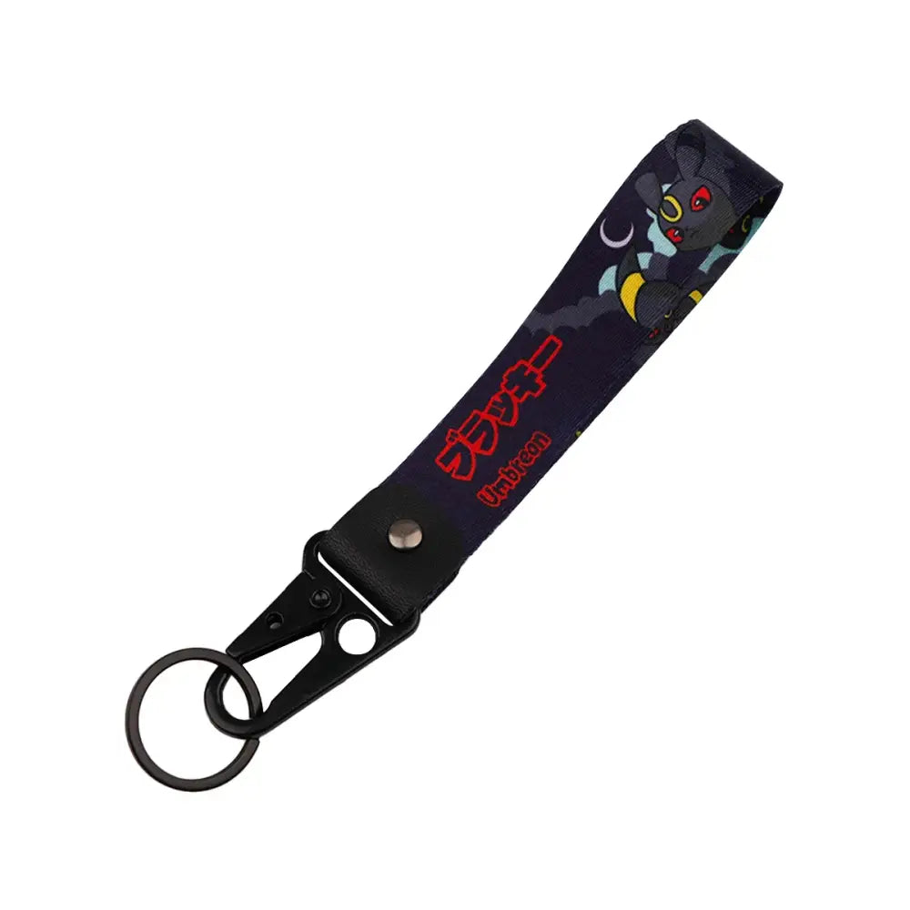 Black fabric monster original keychain featuring anime monster with red eyes and yellow accents for car key accessory