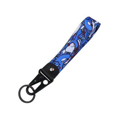 Blue and white cartoon fabric keychain with black metal clip featuring anime monster design for monster original keychain
