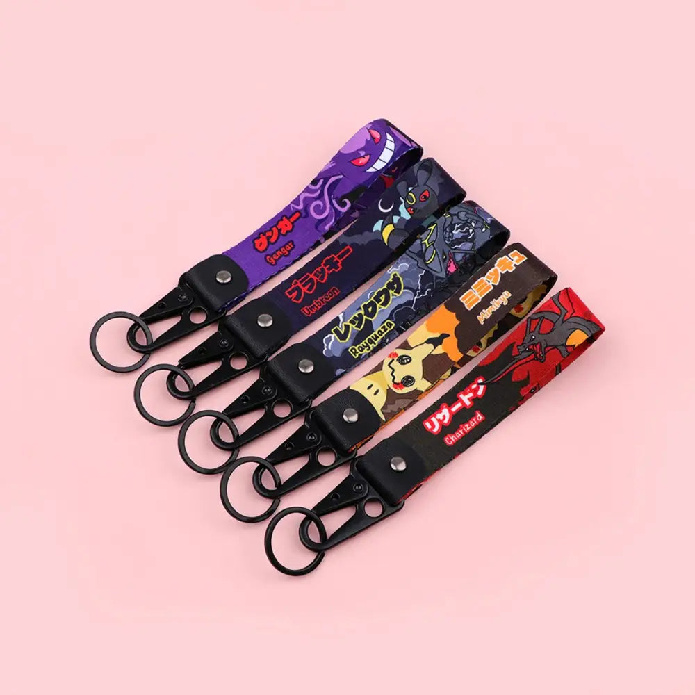 Five colorful monster original keychain fabric straps with anime monster designs black clips and metal rings for car keys