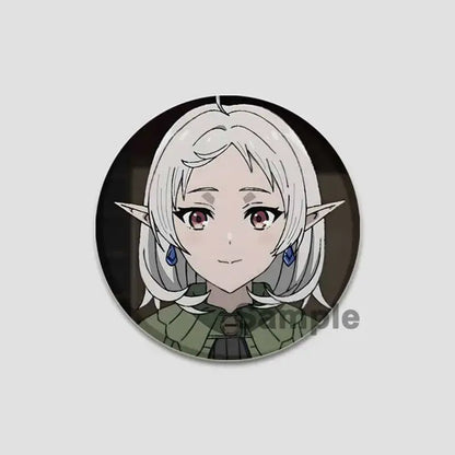 Circular handmade tinplate pin badge featuring roxy migurdia with silver hair, pointed ears, and blue earrings from mushoku tensei