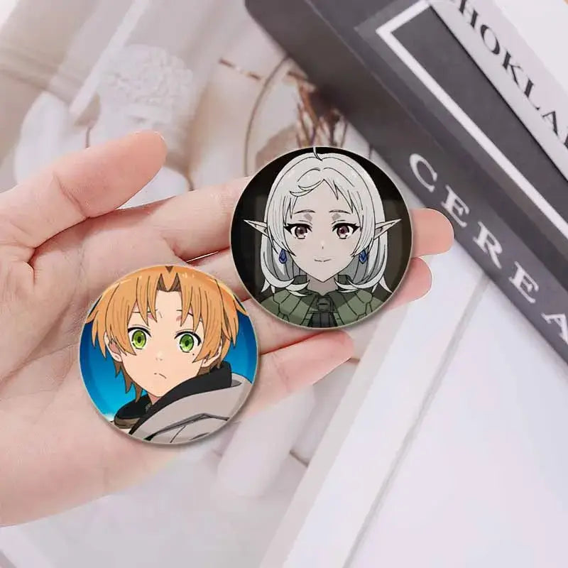 Two handmade tinplate pin badges featuring roxy migurdia and a blonde-haired boy from mushoku tensei anime