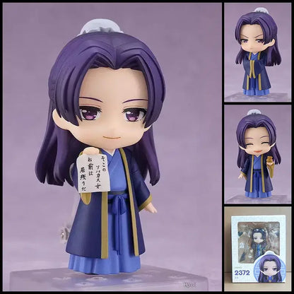Purple-haired mushoku tensei roxy migurdia figure in blue and gold robe with posable design holding japanese sign