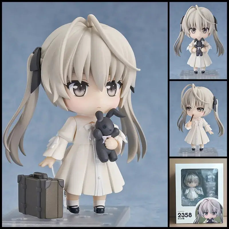 A chibi-style posable roxy migurdia figure from mushoku tensei with long silver hair black bows and a dark gray stuffed rabbit