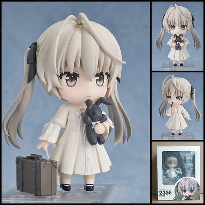 A chibi-style posable roxy migurdia figure from mushoku tensei with long silver hair black bows and a dark gray stuffed rabbit