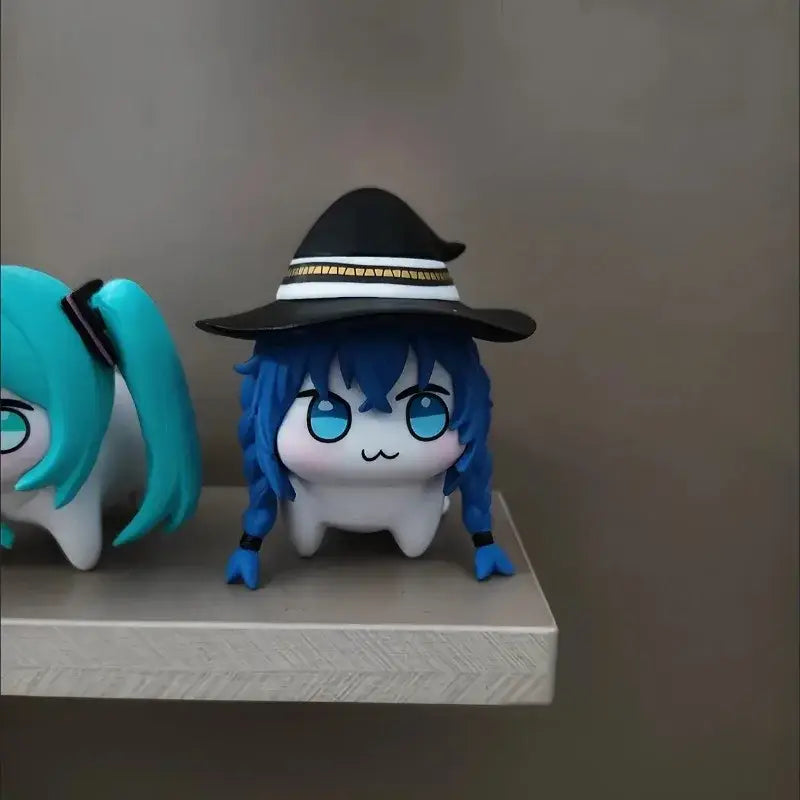 Blue-haired chibi-style mushoku tensei roxy pvc figure wearing black witch hat with gold and white trim for desktop decor