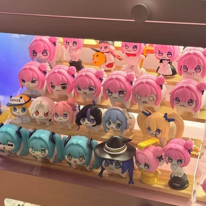 A colorful collection of chibi-style mushoku tensei roxy pvc figures displayed as cute desktop decor on wooden shelves