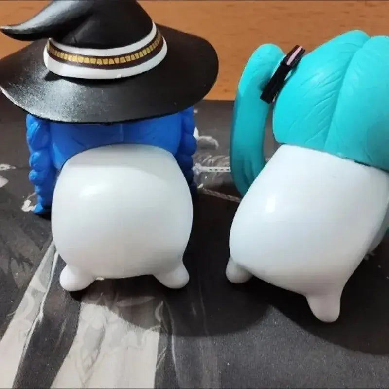 Two plush mushoku tensei roxy figurines one in black witch hat and the other with teal pigtails tensei roxy pvc decor
