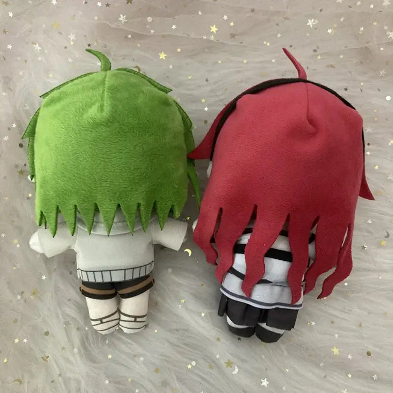 Two mushoku tensei sylphy plush dolls with vibrant green and red hair in matching white and black striped outfits