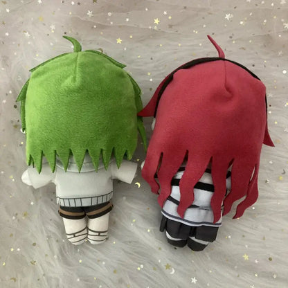 Two mushoku tensei sylphy plush dolls with vibrant green and red hair in matching white and black striped outfits