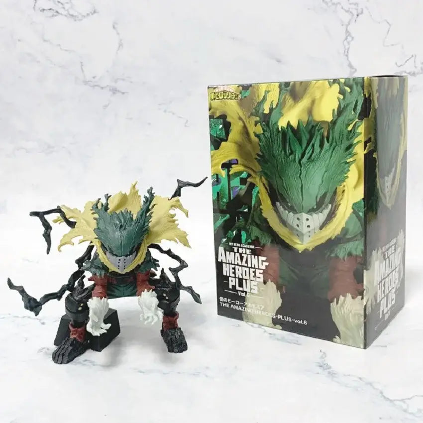 Green and yellow spiky-haired bakugo pvc figure with red accents standing beside its box from hero academia series