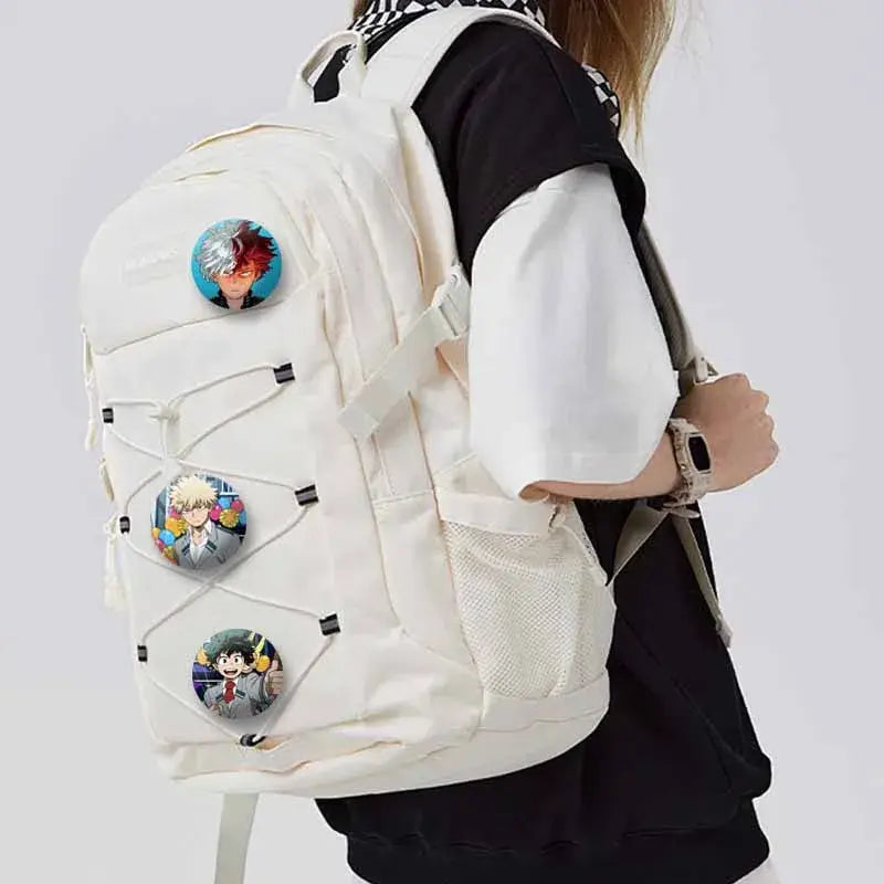 Cream-colored canvas backpack with three my hero academia tinplate coin brooch anime character pins on front